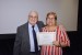 Dr. Nagib Callaos, General Chair, giving Dr. Aurora Trujillo-Cotera an award certificate in appreciation for his presentation oriented to inter-disciplinary communication entitled: "Processes of Information Analysis in the Academic Management of the State University at Distance (UNED) for Self-Evaluation in an Inter-Disciplinary Research."
